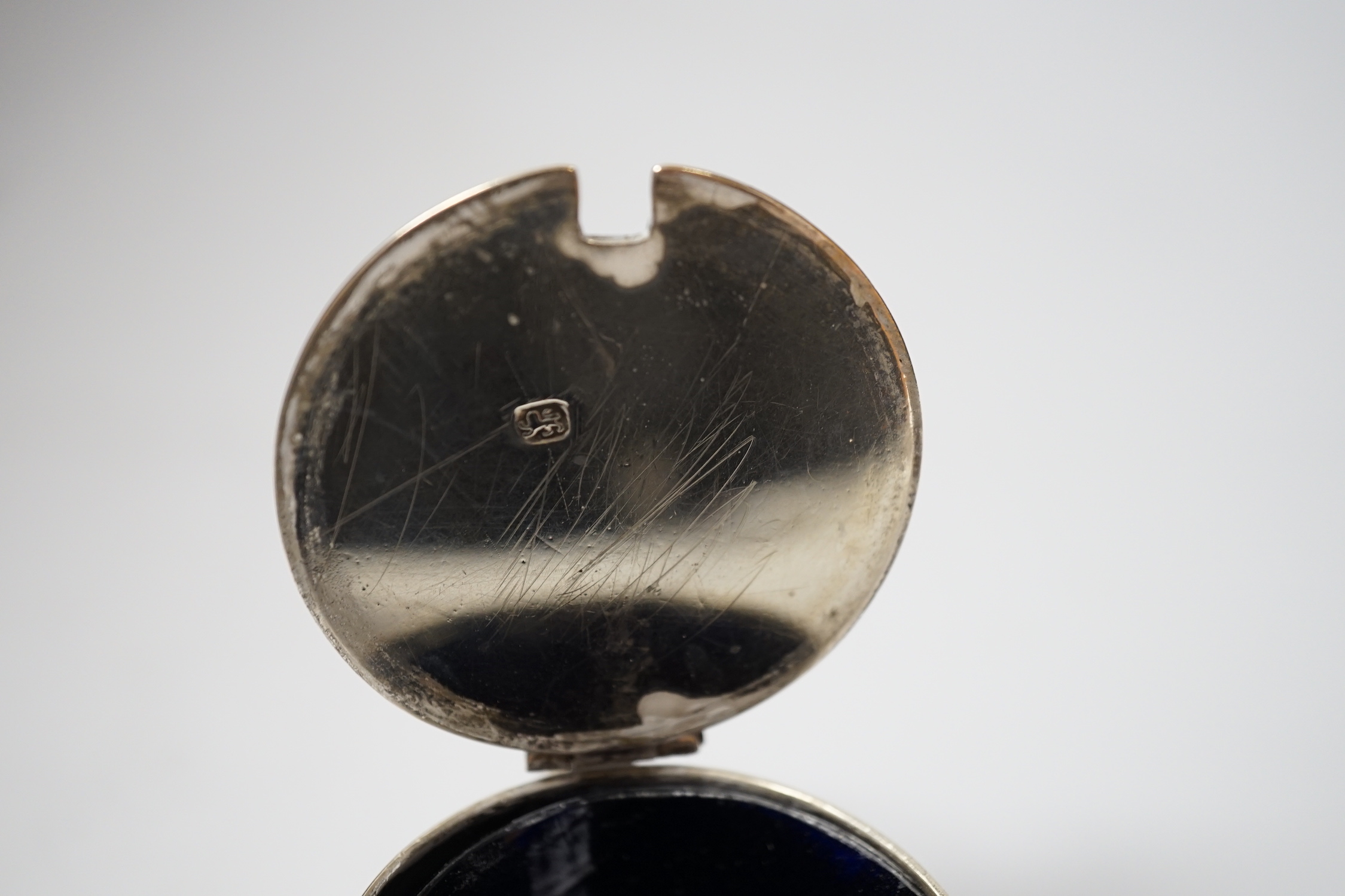 A George III silver barrel shaped mustard pot, Thomas Daniell, London, 1780, 8cm, with later blue glass liner.
